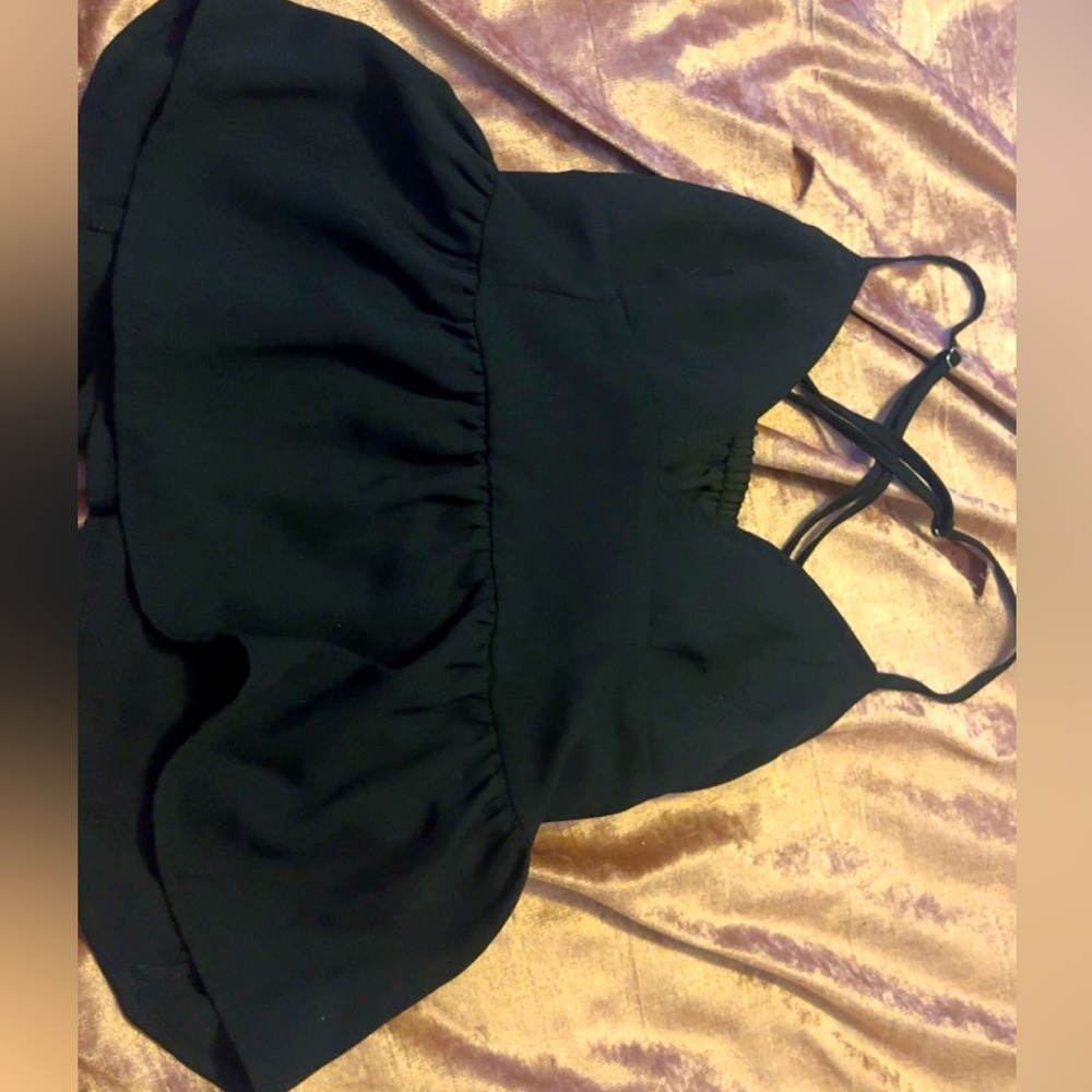 Black tank top, low cut, flowy material, adjustable straps